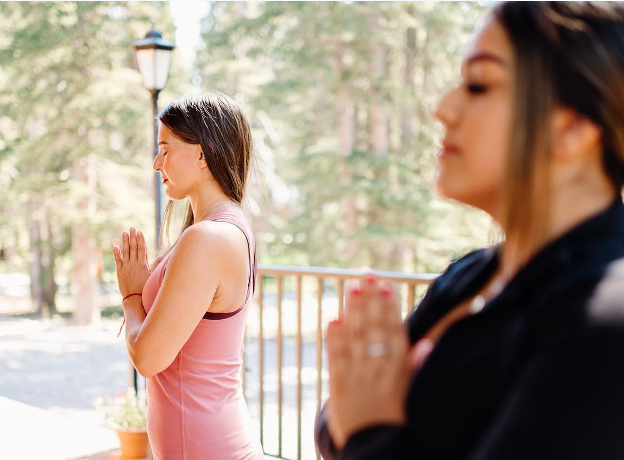 A Vita guest practising breathwork and meditation indoors
